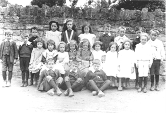 Back Row: George Witcombe, Emily Witcombe, Ada Crossman, A. Bartlett, C. Warburton, C. Witcombe, R. Barlett, W. Witcombe. Centre Row: Stan Wright, Oliver, Oliver, B. Warburton, Elsie Crossman, ?, ?, Addie Napper, Lily Edwards, A. Edwards, H. Burleton Front Row: ?, Bob Crossman, ?