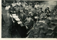 Mr T Bevan conducting the choir Choir singing at Ivythorn Manor 1968